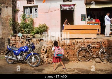 Girl going school ; Nandur ; Marathwada ; Maharashtra ; India NOMR Stock Photo