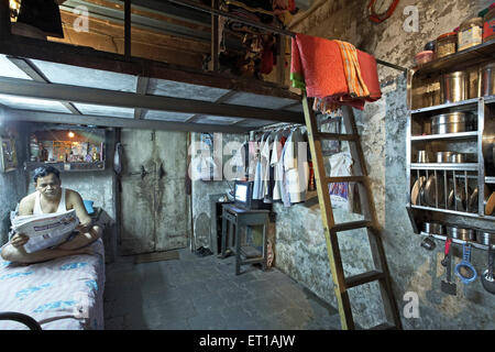 Man Reading Newspaper Textile mill Chawl  Mumbai India Asia Stock Photo