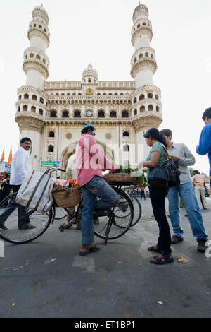 Vegetable seller in front of charminar mosque ; Hyderabad ; Andhra Pradesh ; India Stock Photo