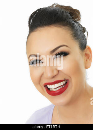 A Very Happy Pleased Beautiful Young Hispanic Woman Smiling and Looking Relaxed Against A White Background Stock Photo