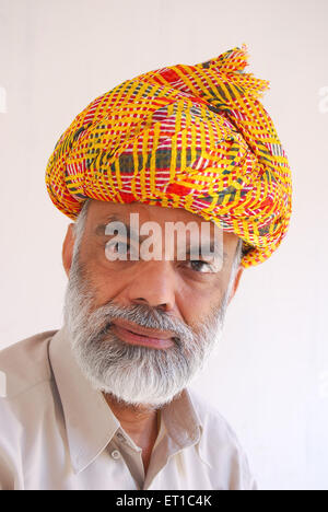Portrait of educated rajasthani man in traditional turban ; Jodhpur ; Rajasthan ; India MR#704 Stock Photo