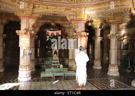 Devotee in Bhanda Shah Jain temple ; Bikaner ; Rajasthan ; India Stock Photo