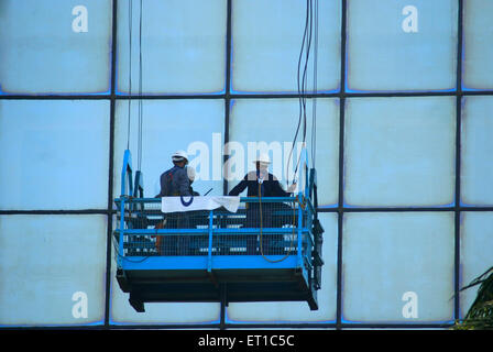 window cleaners ; Delhi ; India ; Asia ; Asian ; Indian Stock Photo