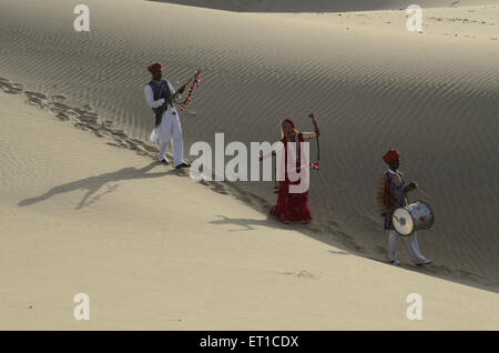 Folk musicians on sand dune in Jaisalmer at Rajasthan India MR#704 Stock Photo