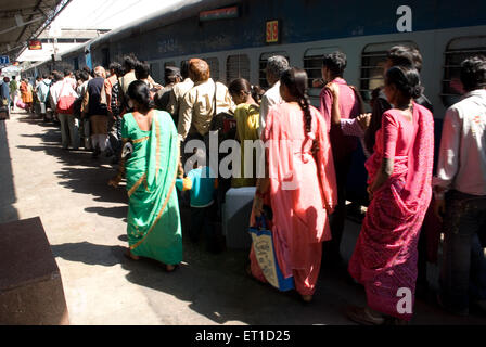 Travellers in queue to board a train on railway station ; Ahmedabad ; Gujarat ; India Stock Photo