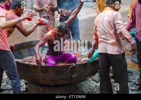 People pouring water with colour in Holi festival  Jodhpur at Rajasthan India Stock Photo