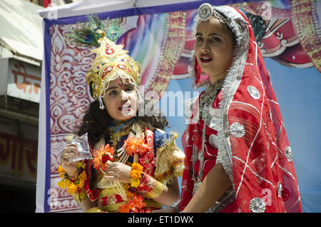 Boy and Girl in fancy dress Radha Krishna in Ramnavami procession Jodhpur Rajasthan India Stock Photo