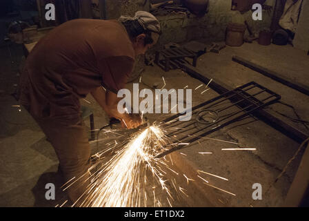 man welding of iron article in Jodhpur at Rajasthan India Stock Photo