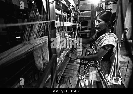 Bodo woman weaving on handloom  ; Assam ; India NO MR Stock Photo