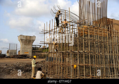 Labors working at bridge construction ; Bombay ; Mumbai ; Maharashtra ; India Stock Photo