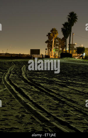 Tracks on the beach at night Stock Photo