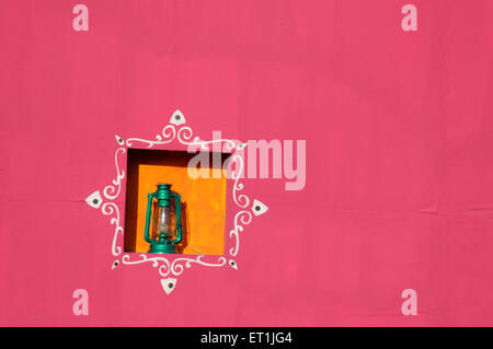 kerosene lantern alcove painted wall ; Pune ; Maharashtra ; India Stock Photo