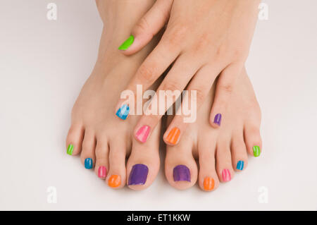 Different colours of nail polish on nails Pune Maharashtra India Asia May 2011 Stock Photo