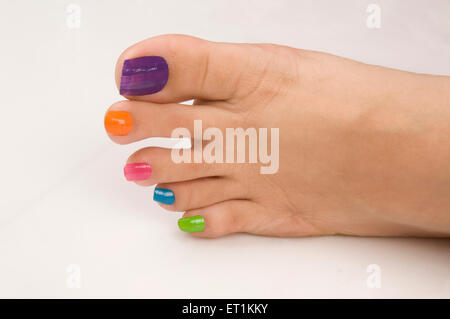 Different colours of nail polish on nails Pune Maharashtra India Asia May 2011 Stock Photo