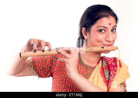 Portrait of Maharashtrian Girl playing flute Pune Maharashtra India Asia MR # 686EE Stock Photo
