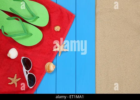 Beach scene in summer on vacation, holiday with sunglasses and towel Stock Photo