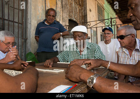 Group of old men playing dominoes Stock Photo