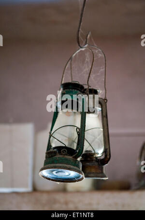 old antique classic glass kerosene lanterns hanging Stock Photo