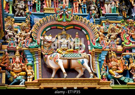 Stucco of shiva and parvati on gopuram of sri meenakshi temple of Madurai ; Tamil Nadu ; India Stock Photo