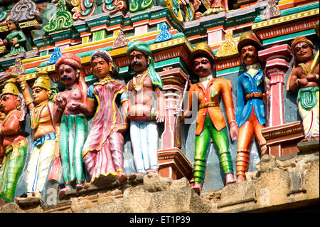 Richly painted stucco figures on gopuram of vishnu alagar kovil temple near Madurai ; Tamil Nadu India Stock Photo