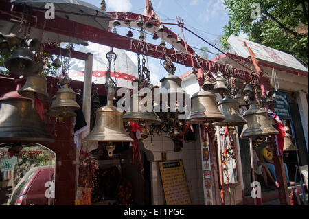 Bells on the gate of road side temple in uttarakhand India Asia Stock Photo