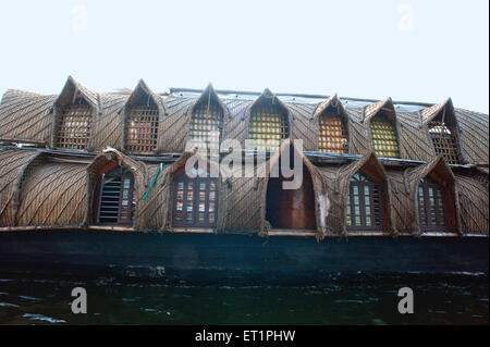 Kettuvallam houseboat with thatched roof in backwaters ; Alleppey ; Alappuzha ; Kerala ; India ; Asia Stock Photo