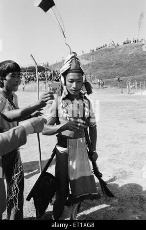 Wancho tribal holding gun ; Arunachal Pradesh ; India ; Asia ; old vintage 1900s picture Stock Photo