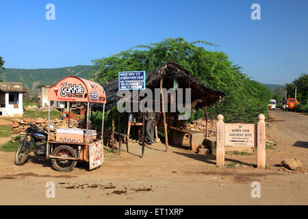 Ancient site signboard ; ice cream vendor bike ; Bhangarh Fort ; Rundh Bhangarh ; Bhangarh ; Rajgarh ; Alwar ; Rajasthan ; India ; Asia Stock Photo