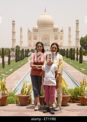 Mother and children standing at Taj Mahal Agra India MR#477 Stock Photo