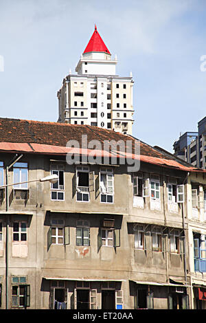 Old mud roof building chawl mass urban housing ; Raja Rammohan Roy Road ; Girgaon ; Charni Road ; Bombay Mumbai Stock Photo