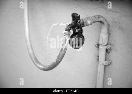 Locked tap in slum ; Mahim Sion Link road ; Bombay ;  Mumbai ; Maharashtra ; India ; Asia ; Asian ; Indian Stock Photo