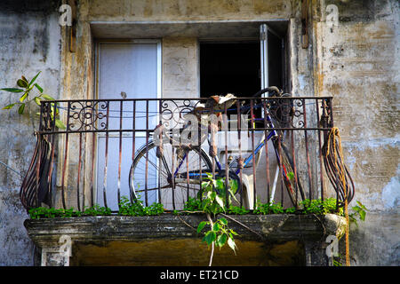 Bicycle in balcony of chawl ; Lower Parel ; Bombay Mumbai ; Maharashtra ; India 26 August 2009 Stock Photo