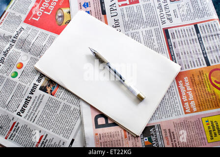 blank paper and pen on newspaper ; Mulund ; Bombay ;  Mumbai ; Maharashtra ; India ; Asia Stock Photo