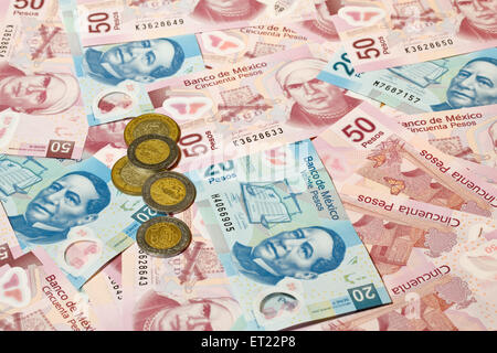 Background of Mexican pesos - 20 and 50 pesos bills and coins Stock Photo