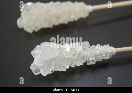 Two sugar sticks on a black surface Stock Photo