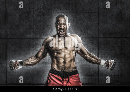 Bald male athlete in a fighting pose Stock Photo