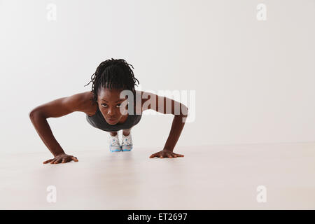 Woman Doing Push-Up Stock Photo