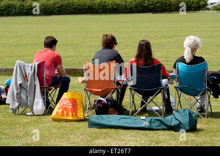 University students watching a polo match Stock Photo