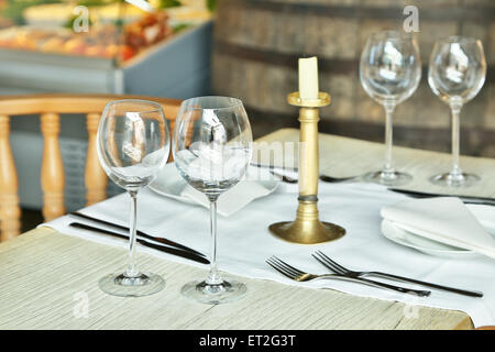 Table setting with wine glasses at the vintage cafe. Stock Photo