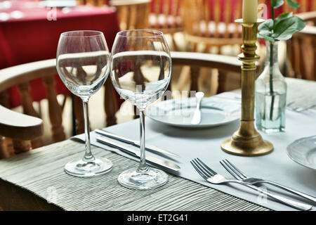 Table setting with wine glasses at the vintage cafe. Stock Photo