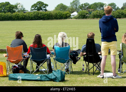 University students watching a polo match Stock Photo