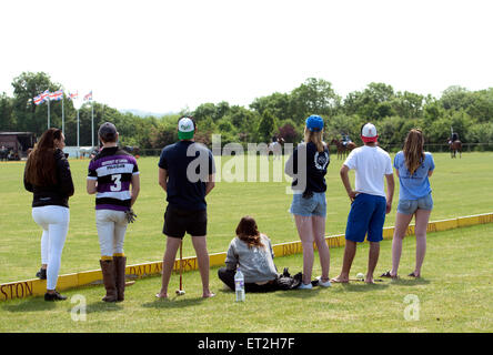 University students watching a polo match Stock Photo