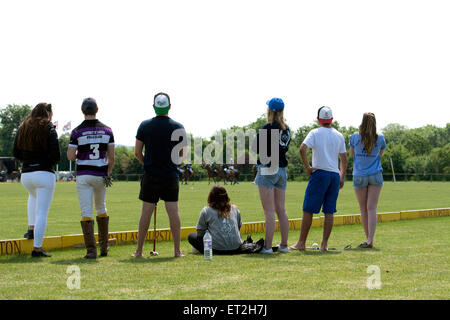 University students watching a polo match Stock Photo