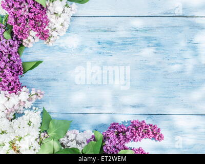 Blooming lilac flowers on the old wooden table. Stock Photo