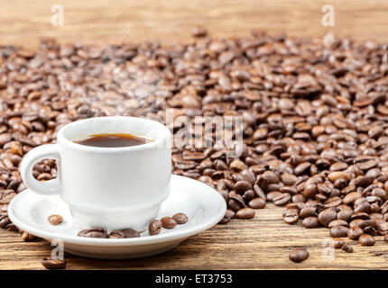 Cup of black hot coffee on wooden table, shallow depth of field. Stock Photo