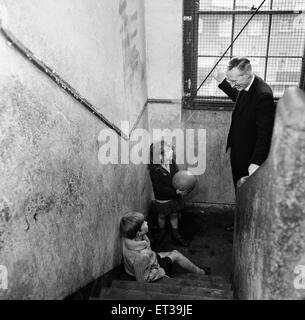 Slums, Benburb street area of Dublin, Republic of Ireland, 11th May 1968. Dublin slums controlled by the municipal authority, the Dublin Corporation, which has had to ignore standards of hygiene and sanitation. Pictured. Father Michael Sweetman, a priest Stock Photo