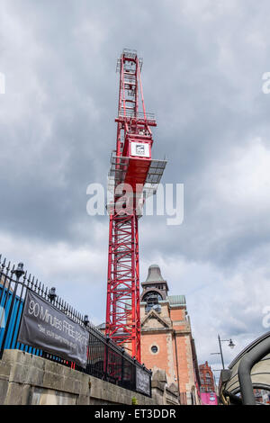 Large crane in the centre od Bolton Town centre this is being used to build a new cinema in the market place shopping centre Stock Photo