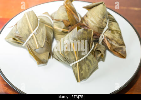 Zongzi in a plate. Zhongzi is a traditional Chinese food eaten during Dragon boat Festival Stock Photo