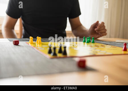 Mid section of a man playing board game, Bavaria, Germany Stock Photo
