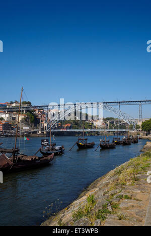 Wooden boats (Rabelos) moored on the river Douro by Cais de Gaia nearby the Ponte Luis I - Porto, Portugal Stock Photo